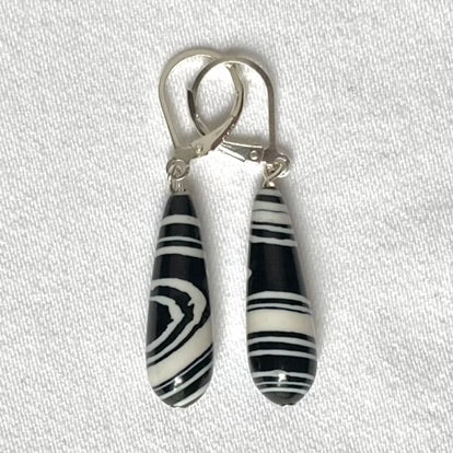 Reconstructed Agate in a swirl pattern in black and white - 22mm.  Complete with Sterling Silver lever backs.